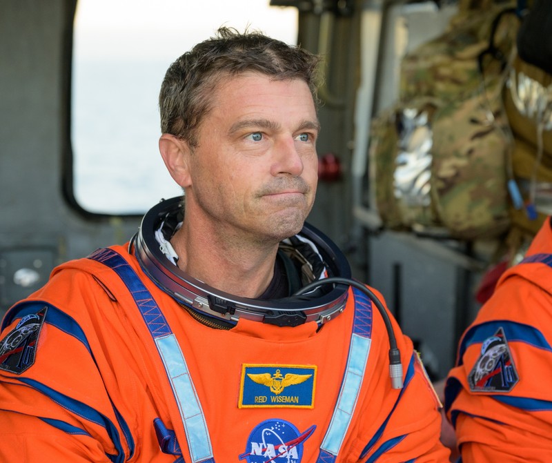 NASA astronaut Victor Glover, Artemis II pilot, left, and NASA astronaut Christina Koch, Artemis II mission specialist are seen sitting on a Navy MH-60 Seahawk from Helicopter Sea Combat Squadron (HSC) 23 on the flight deck of USS John P. Murtha after they and fellow crewmates CSA (Canadian Space Agency) astronaut Jeremy Hansen, Artemis II mission specialist, and NASA astronaut Reid Wiseman, Artemis II commander, were extracted from their Orion spacecraft after splashdown, Friday, April 10, 2026, in the Pacific Ocean off the coast of California. NASA’s Artemis II mission took the quartet on a nearly 10-day journey around the Moon and back to Earth. Following a splashdown at 5:07 p.m. PDT (8:07 p.m. EDT), NASA, U.S. Navy, and U.S. Air Force teams are working to bring the Orion spacecraft aboard the recovery ship.