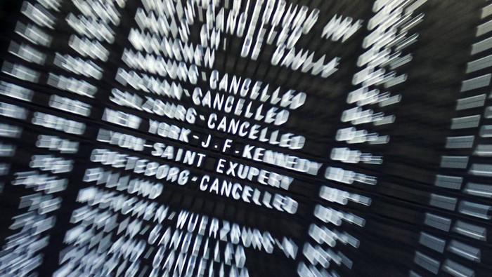 A person points at an information panel that shows flights, many of which are cancelled, during a strike by the UFO union, representing Lufthansa cabin crew, at Frankfurt Airport, Germany, April 10, 2026. REUTERS/Heiko Becker