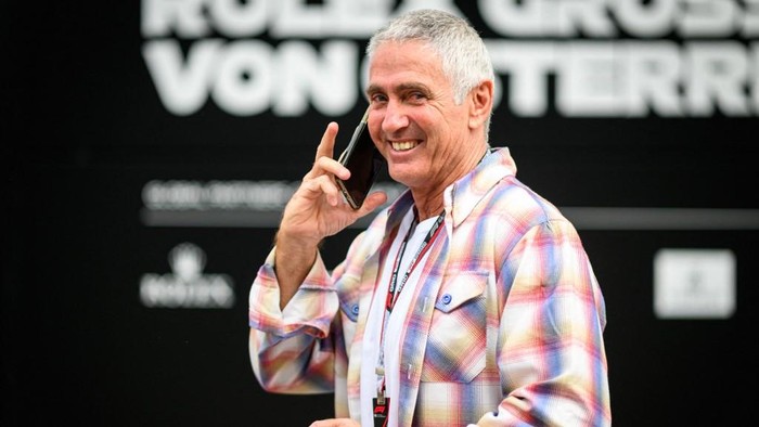 Former Australian motorcycle racer Mick Doohan walks through the paddock of the Red Bull Ring race track in Spielberg, Austria, on July 7, 2022, ahead of the Formula One Austrian Grand Prix. (Photo by Jure Makovec / AFP)
