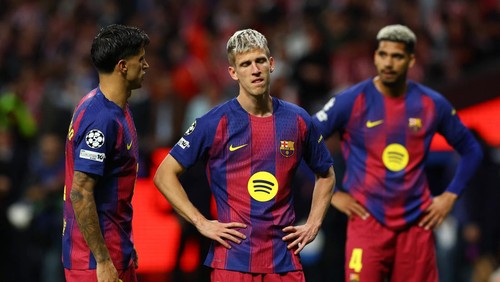 Soccer Football - UEFA Champions League - Quarter Final - Second Leg - Atletico Madrid v FC Barcelona - Riyadh Air Metropolitano, Madrid, Spain - April 14, 2026 FC Barcelonas Joao Cancelo and Dani Olmo look dejected after the match REUTERS/Albert Gea