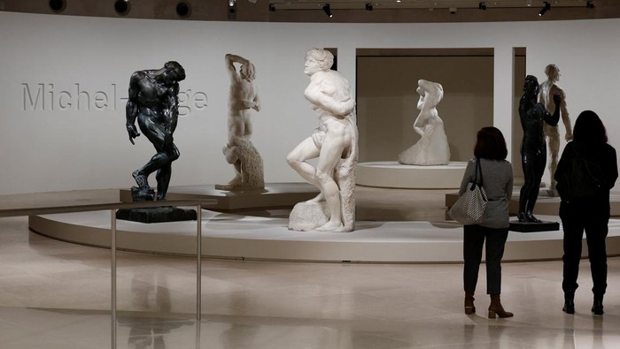 Adam (1880-1881) sculpture by French sculptor Auguste Rodin, the Dying Slave (1513-1515) and the Rebellious Slave (1513-1515) sculptures by Italian Renaissance master Michelangelo stand on display during a press visit of the 