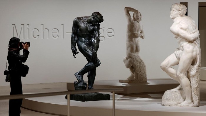 Adam (1880-1881) sculpture by French sculptor Auguste Rodin, the Dying Slave (1513-1515) and the Rebellious Slave (1513-1515) sculptures by Italian Renaissance master Michelangelo stand on display during a press visit of the 