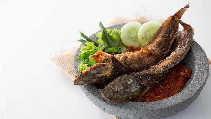 traditional indonesian culinary food. sambal and penyetan pecel lele. catfish with hot chili sauce