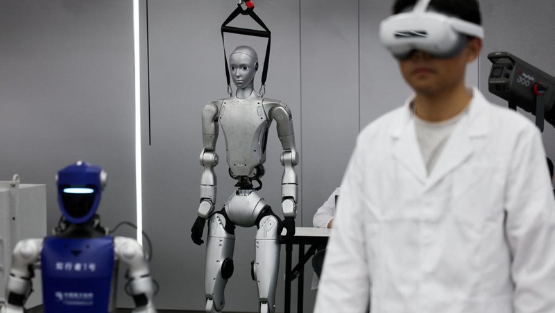Robotic arms demonstrate maintaining high-voltage power lines at China Southern Power Grid's robotics laboratory during a government-organized media trip in Guangzhou, Guangdong province, China, April 16, 2026.  REUTERS/Go Nakamura