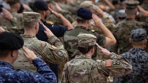 Philippine and U.S. soldiers salute during the flag ceremony at the opening ceremony of the U.S.-Philippines Balikatan joint military exercises, at Camp Aguinaldo in Quezon City, Metro Manila, Philippines, April 20, 2026. REUTERS/Noel Celis