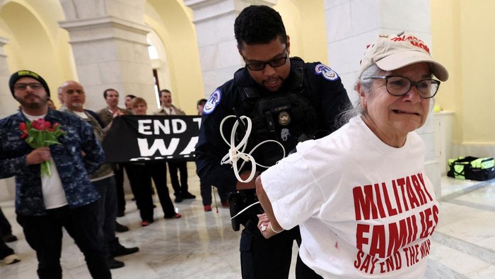 Veterans with the group About Face perform a flag-folding ceremony as they protest against the Iran war, in the Cannon House Office Building Rotunda on Capitol Hill in Washington, D.C., U.S., April 20, 2026. REUTERS/Kevin Lamarque