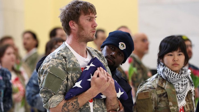 Veterans with the group About Face perform a flag-folding ceremony as they protest against the Iran war, in the Cannon House Office Building Rotunda on Capitol Hill in Washington, D.C., U.S., April 20, 2026. REUTERS/Kevin Lamarque