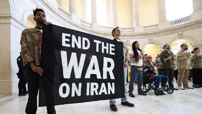 Veterans with the group About Face perform a flag-folding ceremony as they protest against the Iran war, in the Cannon House Office Building Rotunda on Capitol Hill in Washington, D.C., U.S., April 20, 2026. REUTERS/Kevin Lamarque