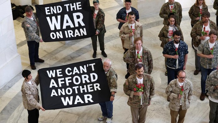 Veterans with the group About Face perform a flag-folding ceremony as they protest against the Iran war, in the Cannon House Office Building Rotunda on Capitol Hill in Washington, D.C., U.S., April 20, 2026. REUTERS/Kevin Lamarque