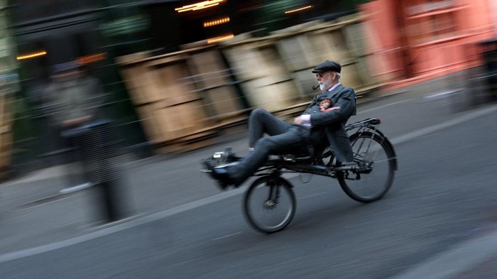 People ride their bicycles during the annual Tweed Run across London, Britain, April 18, 2026. REUTERS/Hannah McKay