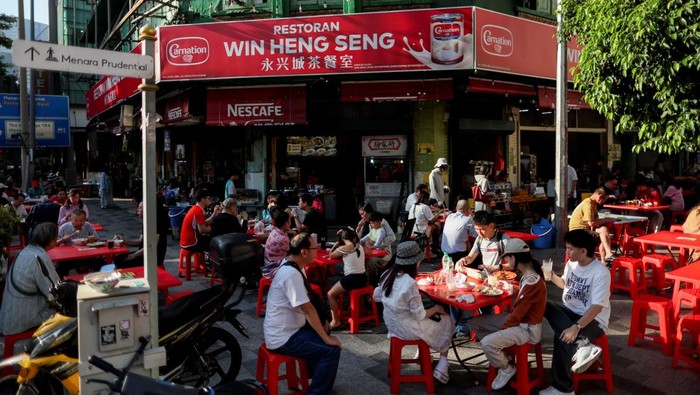 People have their breakfast at a kopitiam (eateries serving local food) in Kuala Lumpur, Malaysia, March 17, 2026. REUTERS/Hasnoor Hussain