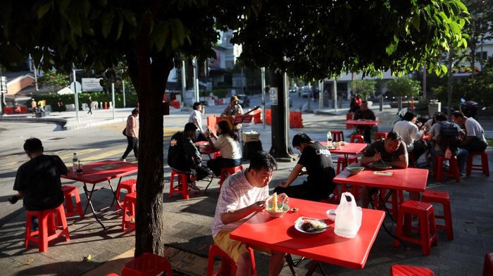 People have their breakfast at a kopitiam (eateries serving local food) in Kuala Lumpur, Malaysia, March 17, 2026. REUTERS/Hasnoor Hussain