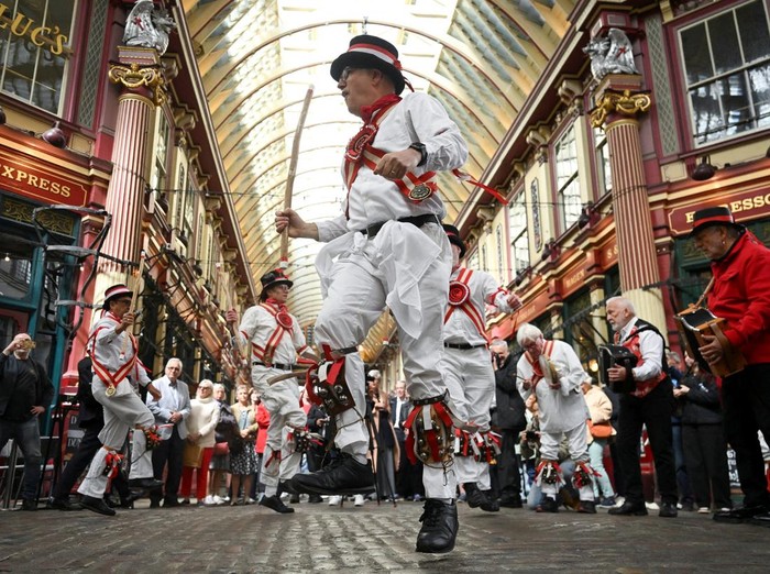 A Morris dancer, new to the group, performs solo at Leadenhall Market to mark St. George's Day, in London, Britain, April 23, 2026. REUTERS/Jaimi Joy