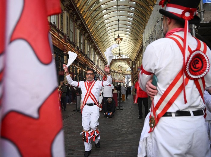 A Morris dancer, new to the group, performs solo at Leadenhall Market to mark St. George's Day, in London, Britain, April 23, 2026. REUTERS/Jaimi Joy