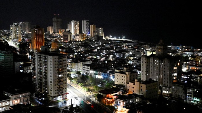 Buildings and street lights illuminate the night as Cubans this week began to reap the benefits of a recent 100,000 metric ton delivery of Russian oil, a temporary lifeline for the energy-starved nation and the first major shipment of oil to the island since the United States moved to cut off its fuel early this year, in Havana, Cuba April 23, 2026. REUTERS/Norlys Perez