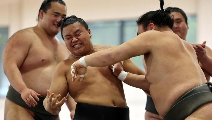 Sumo wrestlers take part in a training session before the 'Honozumo' ceremonial sumo tournament at the Yasukuni Shrine in Tokyo, Japan, April 13, 2026. REUTERS/Issei Kato