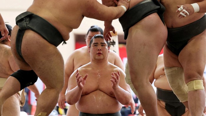 Sumo wrestlers take part in a training session before the 'Honozumo' ceremonial sumo tournament at the Yasukuni Shrine in Tokyo, Japan, April 13, 2026. REUTERS/Issei Kato