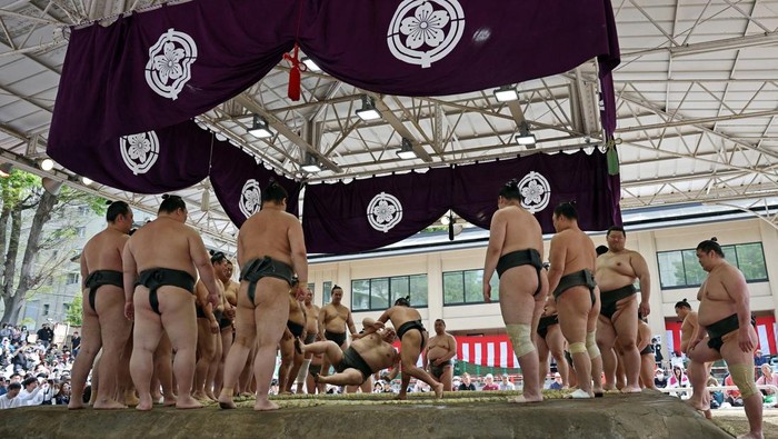 Sumo wrestlers take part in a training session before the 'Honozumo' ceremonial sumo tournament at the Yasukuni Shrine in Tokyo, Japan, April 13, 2026. REUTERS/Issei Kato