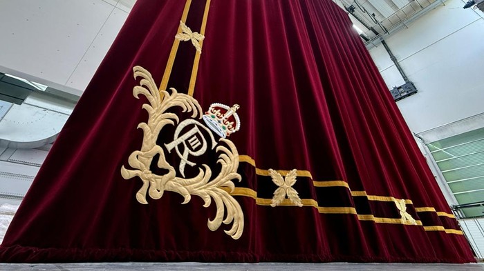One of two parts of the new London Royal Opera House stage curtains is pictured at the Gerriets workshop in Volgelsheim, France, April 16, 2026.    REUTERS/Timm Reichert