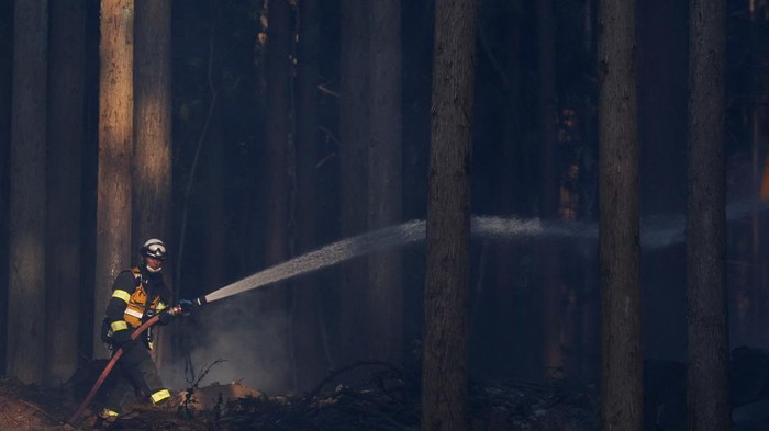 Smoke rises in forest areas as wildfires continue in Otsuchi, Iwate Prefecture, Japan, April 25, 2026. Picture taken with a long exposure. REUTERS/Kim Kyung-Hoon     TPX IMAGES OF THE DAY