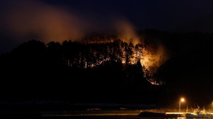 Smoke rises in forest areas as wildfires continue in Otsuchi, Iwate Prefecture, Japan, April 25, 2026. Picture taken with a long exposure. REUTERS/Kim Kyung-Hoon TPX IMAGES OF THE DAY