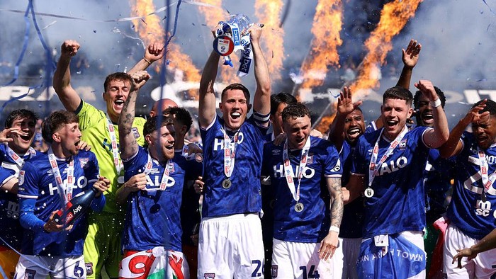 IPSWICH, ENGLAND - MAY 02: Dara OShea of Ipswich Town lifts the Sky Bet Championship runners up trophy following the Sky Bet Championship match between Ipswich Town and Queens Park Rangers at Portman Road on May 02, 2026 in Ipswich, England. (Photo 