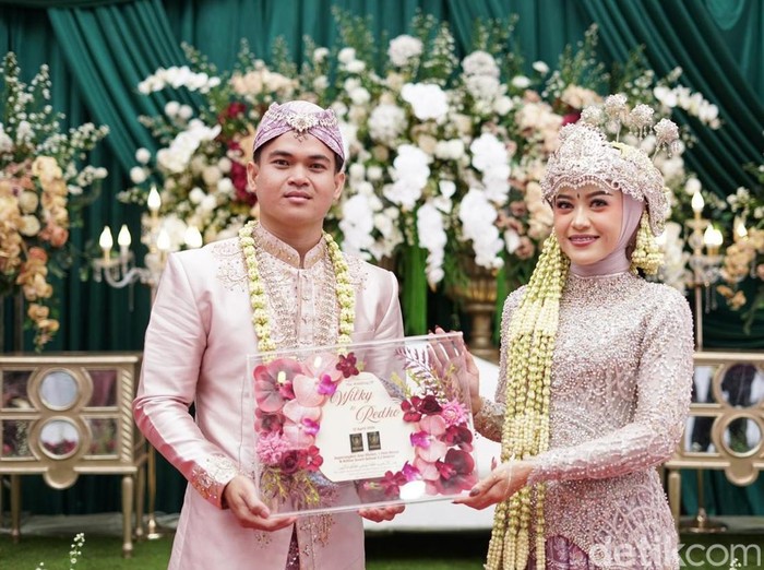 Foto pernikahan Wilky Windya dan Redho Abdul Mufli.