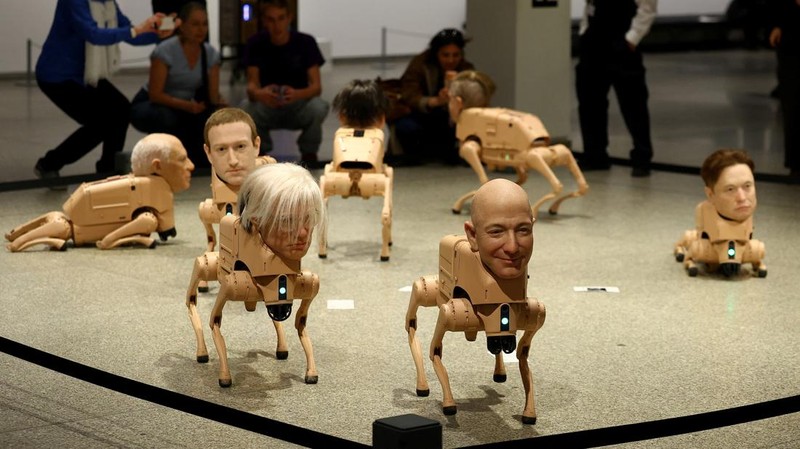 Visitors view robotic dogs with silicone heads modelled after Mark Zuckerberg, Andy Warhol, Kim Jong Un and others, at the interactive art installation 'Beeple. Regular Animals' by the artist Beeple (Mike Winkelmann), at the Neue Nationalgalerie in Berlin, Germany, April 30, 2026. REUTERS/Lisi Niesner
