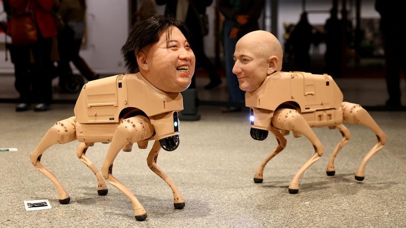 Visitors view robotic dogs with silicone heads modelled after Mark Zuckerberg, Andy Warhol, Kim Jong Un and others, at the interactive art installation 'Beeple. Regular Animals' by the artist Beeple (Mike Winkelmann), at the Neue Nationalgalerie in Berlin, Germany, April 30, 2026. REUTERS/Lisi Niesner