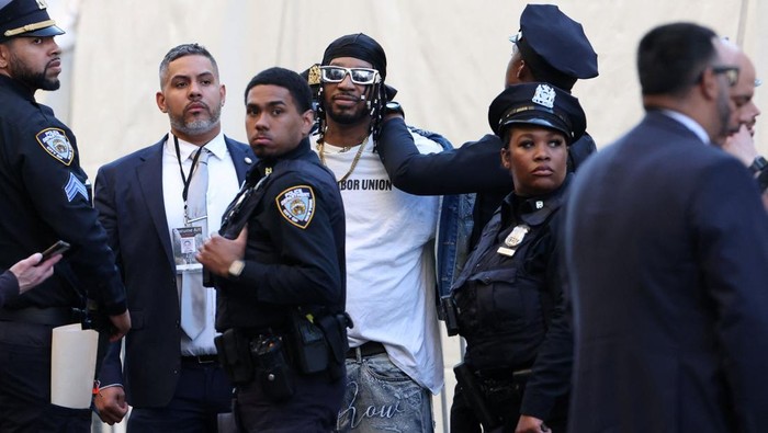 Chris Smalls is detained after trying to enter the venue with a protest sign during the Met Gala, an annual fundraising gala held for the benefit of the Metropolitan Museum of Art's Costume Institute with this year's theme 'Costume Art' in New York City, New York, U.S., May 4, 2026. REUTERS/Brendan Mcdermid
