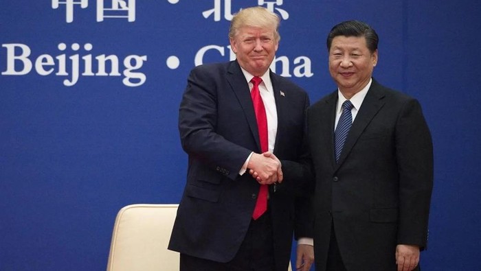 Trump dan Xi Jinping saat bertemu di Beijing, China, pada tahun 2017 silam (dok. AFP) 
