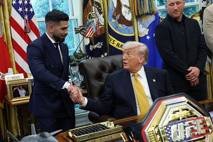 WASHINGTON, DC - MAY 06: U.S. President Donald Trump shakes hands with UFC fighter Ilia Topuria (L) during an event in the Oval Office of the White House on May 06, 2026 in Washington, DC. Trump was joined by UFC fighters to talk about the June 14th 