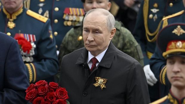 Russian President Vladimir Putin attends a ceremony to lay flowers at the Tomb of the Unknown Soldier by the Kremlin wall in central Moscow on May 9, 2026. Russia celebrates the 81st anniversary of the Soviet Union's victory over Nazi Germany in World War Two (WWII). (Photo by Alexander NEMENOV / POOL / AFP)