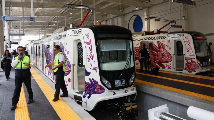 Employees of the light rail line stand as the Mexico City government opens the renovated light rail line, one of the key infrastructure projects aimed at improving accessibility during the World Cup, in Mexico City, Mexico, May 11, 2026.   REUTERS/Henry Romero