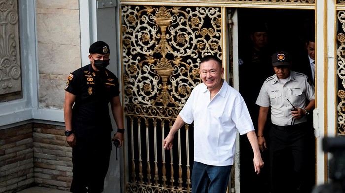 Former Thai Prime Minister Thaksin Shinawatra reacts following his release on parole after serving eight months of his one-year sentence at Klong Prem Central Prison, in Bangkok, Thailand, May 11, 2026. REUTERS/Chalinee Thirasupa