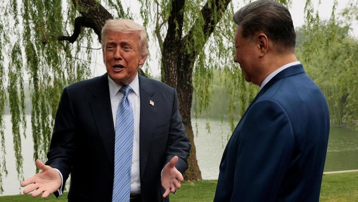 U.S. President Donald Trump participates in a friendship walk through Zhongnanhai Garden with Chinese President Xi Jinping in Beijing, China, May 15, 2026. REUTERS/Evan Vucci/Pool