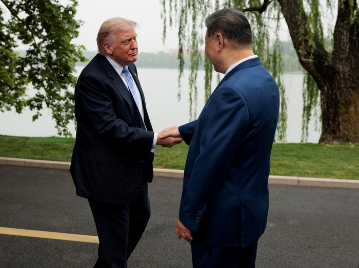 U.S. President Donald Trump participates in a friendship walk through Zhongnanhai Garden with Chinese President Xi Jinping in Beijing, China, May 15, 2026. REUTERS/Evan Vucci/Pool