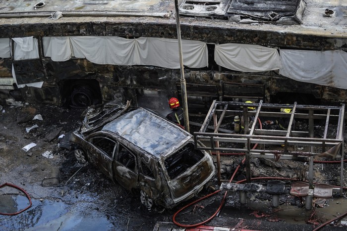 BANGKOK, THAILAND - MAY 16: Emergency services and ambulances are prepared at the scene of a collision on May 16, 2026 in Bangkok, Thailand. A freight train, public bus, cars and motorcycles collided on Asok Din Daeng Road in central Bangkok, killing