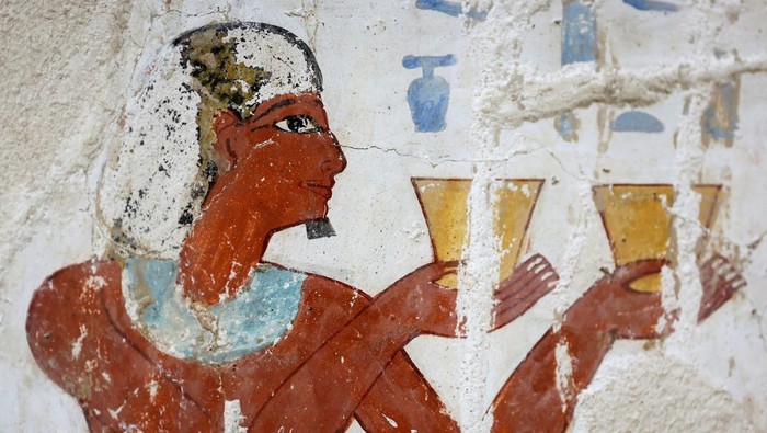 A visitor takes a photo inside the recently restored ancient 