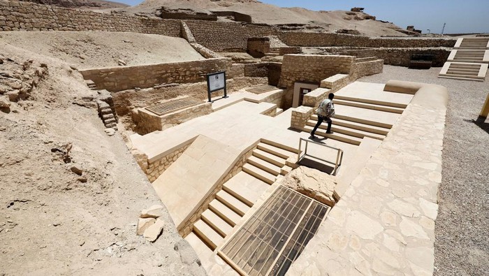 A visitor takes a photo inside the recently restored ancient 