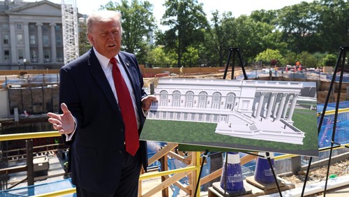 U..S. President Donald Trump shows images of the concept at the site of ongoing construction of the planned White House ballroom in Washington, D.C., U.S., May 19, 2026. REUTERS/Kevin Lamarque