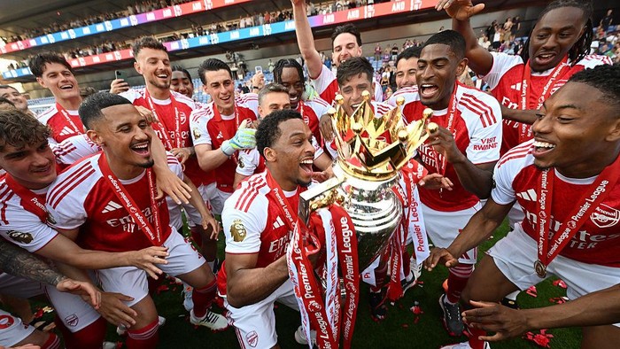 LONDON, ENGLAND - MAY 24: Arsenals William Saliba, Jurrien Timber, Cristhin Mosquera and Myles Lewis-Skelly celebrate after the Premier League match between Crystal Palace and Arsenal at Selhurst Park on May 24, 2026 in London, England. (Photo by Stuart MacFarlane/Arsenal FC via Getty Images)