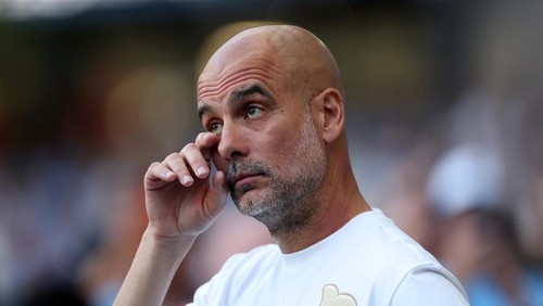 MANCHESTER, ENGLAND - MAY 24: Pep Guardiola, Manager of Manchester City, reacts as a montage of his time at Manchester City is played on the LED screen inside the stadium following the Premier League match between Manchester City and Aston Villa at the Etihad Stadium on May 24, 2026 in Manchester, England. (Photo by Carl Recine/Getty Images)