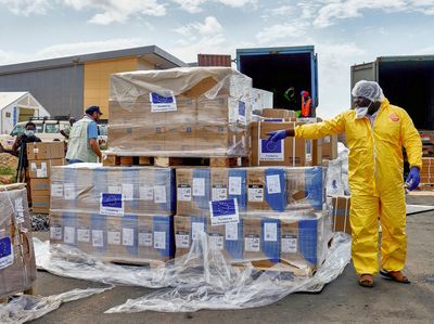UNICEF staff and airport workers handle aid from UNICEF and the European Civil Protection and Humanitarian Aid Operations (ECHO) for the Ebola outbreak caused by the Bundibugyo strain, at Bunia National Airport in Bunia, Ituri province, Democratic Re