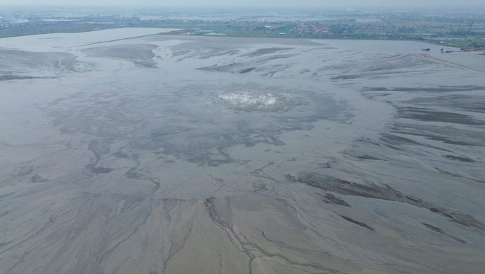 A drone view shows steam rising at the site of the Lapindo mudflow, which has been flowing since a 2006 gas exploration accident that swamped villages and permanently displaced tens of thousands of people, in Sidoarjo, East Java province, Indonesia, May 30, 2026. REUTERS/Dipta Wahyu