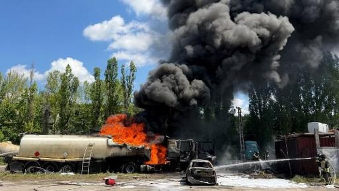 Ukrainian rescuers work to extinguish a fire following an air attack on an industrial infrastructure facility in Zaporizhzhia on May 15, 2026, amid the Russian invasion of Ukraine.  (Photo by Darya NAZAROVA / AFP)