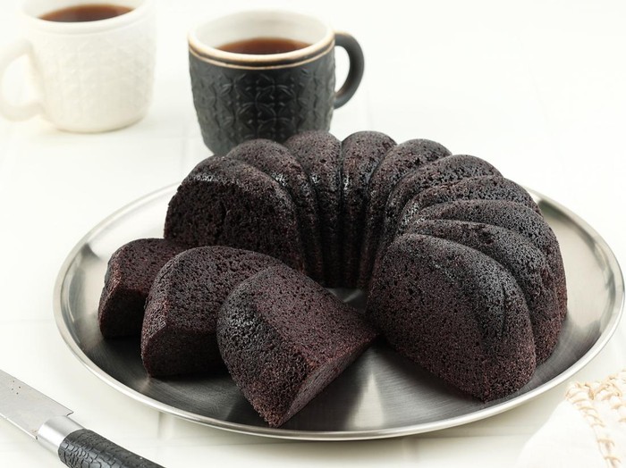 Bolu Ketan Hitam, Black Sticky Rice Cake Indonesian Snack Made from Black Sticky Rice Flour, Sugar, and Eggs. Copy Space for Text