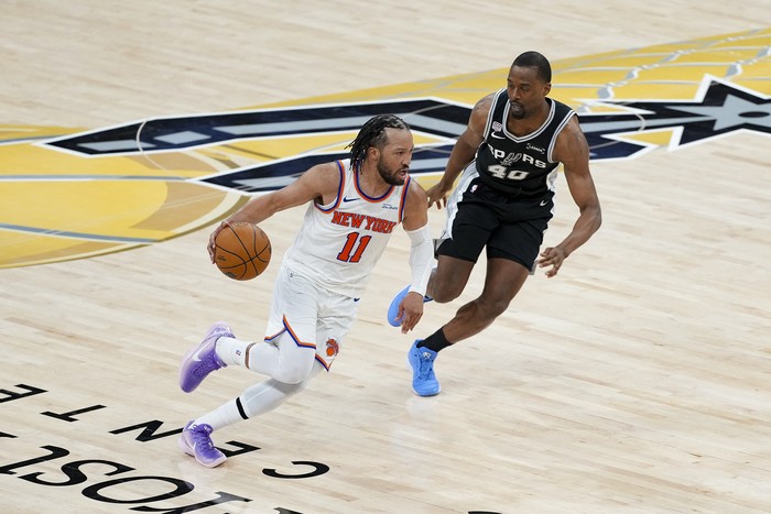 Jun 3, 2026; San Antonio, Texas, USA; New York Knicks guard Jalen Brunson (11) looks to move the ball past San Antonio Spurs forward Harrison Barnes (40) during the fourth quarter during game one of the 2026 NBA Finals at Frost Bank Center. Mandatory
