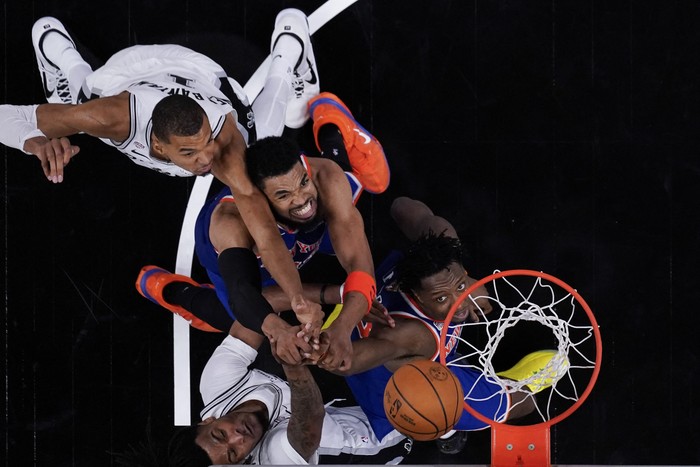 Jun 5, 2026; San Antonio, Texas, USA; New York Knicks forward Og Anunoby, right, New York Knicks center Karl-Anthony Towns, center and San Antonio Spurs forward Victor Wembanyama battle for the ball during game two of the 2026 NBA Finals at Frost Ban