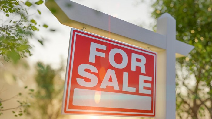 For Sale Real Estate Sign In Front of Property.